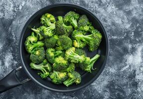 Fried broccoli. Roasted fresh salad. Prepared vegetarian ingredient. Dish with healthy delicious meal. Freshness tasty mediterranean diet. Green vegetable cooked food photo