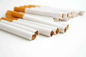 Cigarette, roll tobacco in paper with filter tube, No smoking. photo
