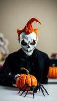 Creepy Halloween Costume with Pumpkin and Spider photo