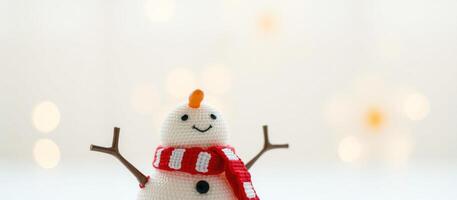 Close-up of a snowman with a red and white scarf photo