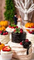 Delicious Wedding Cake with Chocolate Glaze and Berries photo