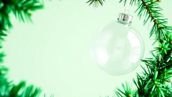 Christmas Ornament with Fir Tree Branch on Green Background photo
