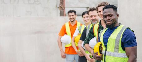 Workers teamwork in construction industrial plant. Diverse workers standing together happy smiling wide for banner with space for text. photo