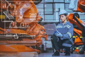 Engineer Staff Using Laptop Computer Technology Software Program Robot In Robotic Industry Factory overlay modern graphics HUD. photo