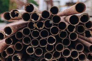 Grunge use round metal pipe anti rust paint used in construction concrete precast form framework photo