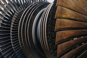 Turbine Blades, High Precision Engineering. Large Fan Stack Layer Metal Part Rotor In Jet Engine Or Steam Power Plant. photo