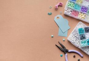 Creating personalized crafts with beads and tags on a light background for various DIY projects photo