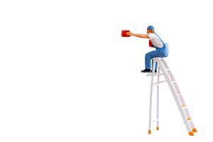 A miniature figurine of a painter seated on a ladder, holding a paint can and brush isolate on white back ground with clipping path photo