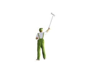 A miniature figurine of a painter holding a long-handled roller brush, isolated on white background with clipping path photo