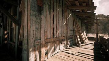 Old wooden structure under bright sunlight in a rustic setting video