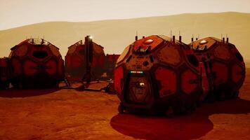 Martian base structures under a reddish sky during twilight exploration video