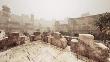 Exploring an ancient eastern city fortifications under a hazy sky video