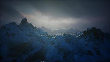 Majestic mountain landscape under a cloudy sky during twilight hours video