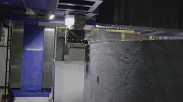 Grinding of concrete wheel at factory. Stock clip. Processing of stone block on rotating machine. Automated grinding machine for stone processing in factory video