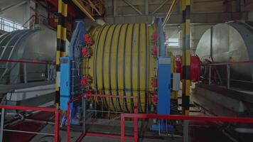 Mechanism with ropes for mines. Stock clip. Drum of winch of mine lifting system in production. Multiple ropes on drum for mine lifting system video