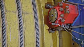 Mechanism with ropes for mines. Stock clip. Drum of winch of mine lifting system in production. Multiple ropes on drum for mine lifting system video