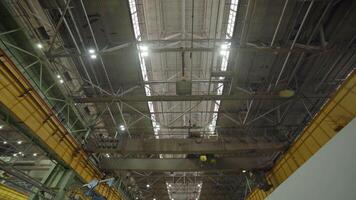 This is an Industrial Facility featuring Overhead Cranes and Modern Lighting Systems. Stock Clip video