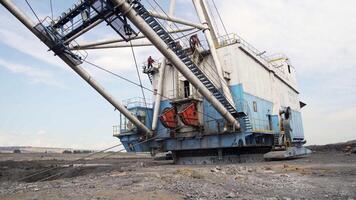 A Massive Excavator Operating at a Mining Site for Resource Extraction and Development. Stock Clip video