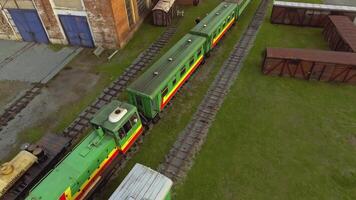 Aerial view of old trams parking on railways station with rust. Stock footage. Tram depot in the countryside. video