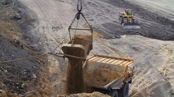 See Heavy Machinery in Action at a bustling Mining Site operating with great efficiency. Stock Clip video