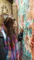 Delving into and exploring the intricate and rich textures of a vividly colorful tapestry video