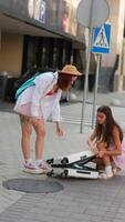 Two Friends Enjoying Their Time and Having Fun with a Colorful Suitcase on the Busy Street video