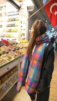 Exploring a vibrant market filled with delightful spices and local goods on an adventure video