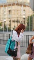 Stylish Young Women Meeting Up in an Urban Setting Captured with Sparkling Reflection video