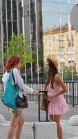 Engaging in a casual conversation while surrounded by a vibrant urban setting, full of life video