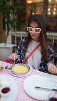 Savoring and Enjoying a Delicious Meal at a Trendy and Inviting Restaurant Setting video