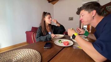 Enjoying a delicious meal together in a cozy and inviting setting with loved ones video