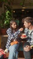 Enjoying a casual coffee conversation in a cozy, inviting cafe that is perfect for relaxing video