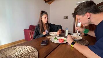 A Couple Happily Enjoying Breakfast Together in a Cozy and Inviting Setting at Home video