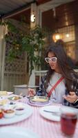 Enjoying a delightful dining experience with friends in a cozy and inviting restaurant setting video