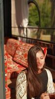 A woman is enjoying a peaceful and relaxing moment in a cozy and comfortable setting video