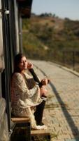 A Relaxing Moment Surrounded by Nature, Enjoying a Cozy and Stylish Outfit in Comfort video