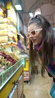 An Enthusiastic Shopper in a Colorful and Vibrant Market Setting Full of Life and Culture video