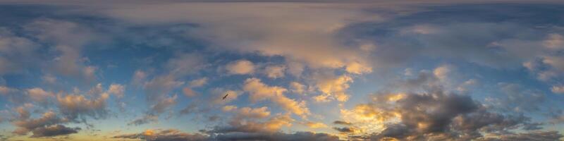 Dark blue sunset sky panorama with golden Cumulus clouds. Seamless hdr 360 panorama in spherical equirectangular format. Full zenith for 3D visualization, sky replacement for aerial drone panoramas. photo