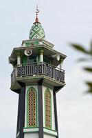The top part of a mosque minaret photo