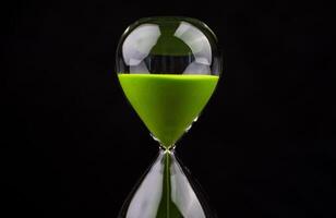 The hourglass indicates limited time and deadlines in which work is competing against the precious time in life. photo