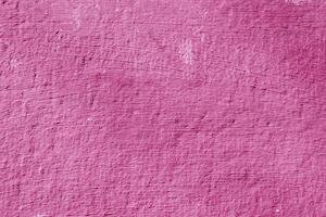 Texture of rough pink plaster. Architectural abstract background. photo