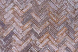 Worn tiled street surface. Abstract construction background. photo