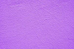 Violet stucco texture. Architectural abstract background. Violet wall of building. photo