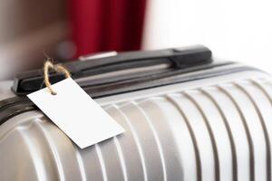 Close up of blank luggage tag label on a suitcase photo