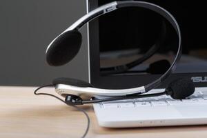headset on keyboard computer laptop photo