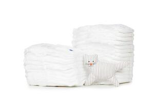 Stack of diapers isolated on white background photo