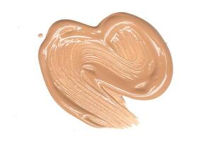 smeared foundation natural make up on white background photo
