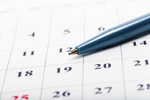Check out the dates in a business calendar concept photo