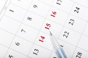 Check out the dates in a business calendar concept photo