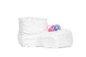 Stack of diapers isolated on white background photo